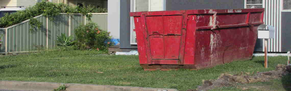 8 cubic meter skip bins Central Coast in front of house with concrete on side