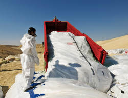 Tipping a skip bin filled with asbestos